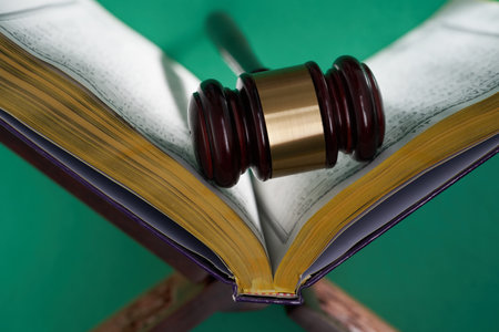 Sharia or Islamic law concept with gavel and koran on green backgroundの写真素材