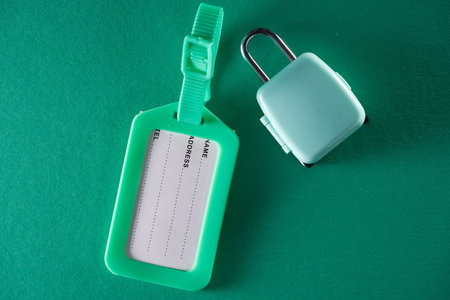 green luggage  tag  on green background