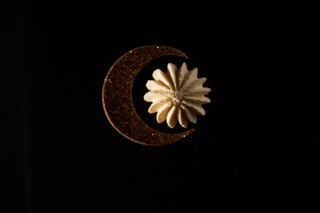 crescent and star shape cookie against black backgroundの写真素材