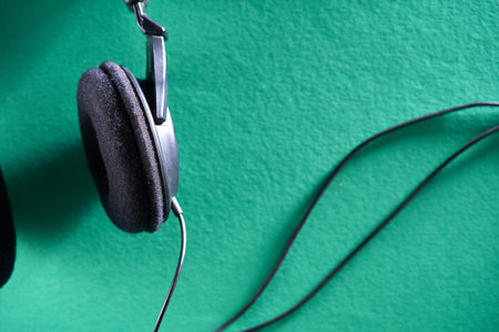 top view of head phone against green background - close upの写真素材