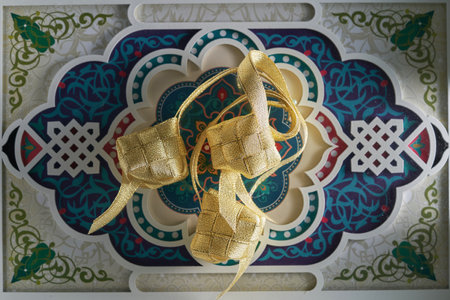 gold color ribbon ketupat on arabic design element food trayの写真素材