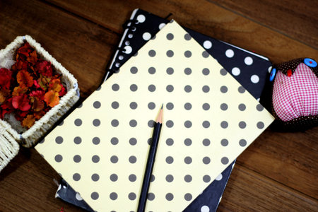 Vintage Working desk with book and pencil set, decorated as a component of the image.