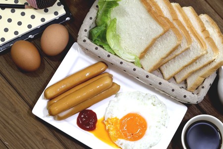 food Fast breakfast with fried eggs, bacon, toastの写真素材