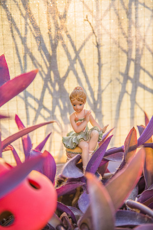 Young dancer in her garden resting after a hard day at workの写真素材