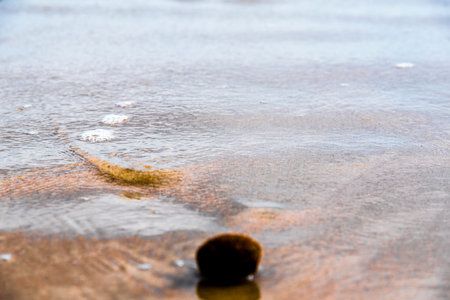 Waves of the sea on the sand of the beach on the Mediterranean coast to warm morning with soft waves...