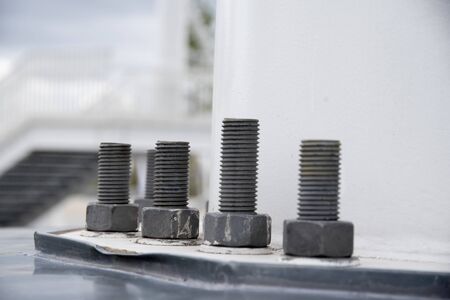 Nut and screw structures that give solidity and firmness to a powerful metal structure from the foundations.の写真素材