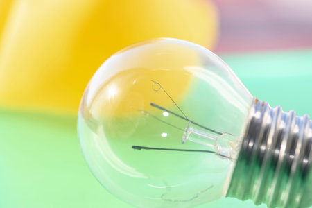 Transparent filament spherical light bulb which is currently no longer in use on a nice bright and...