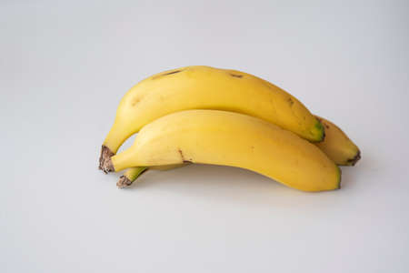 Tasty whole pieces of banana; exquisite canarian fruit ewexposed on a completely white backgroundの写真素材