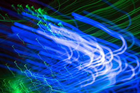 Colorful psychedelic lights and shadows in a dazzling stream of diverse light