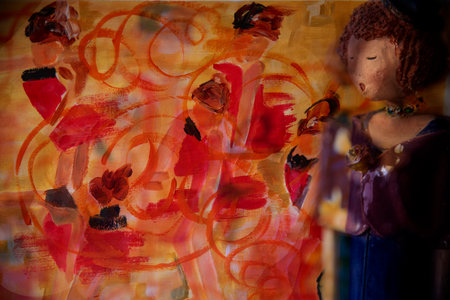 Grunge background with red and orange flowers and a woman paintingの写真素材