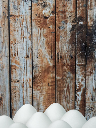 Easter background with white Easter eggs isolated in front of a wooden wallの写真素材