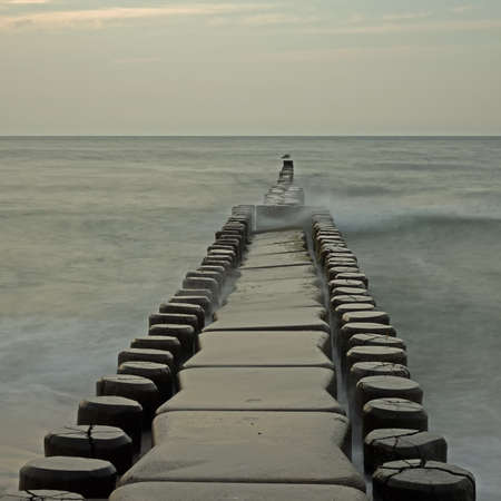 Groyne in the Baltic Sea near to Ahrenshoop, Mecklenburg-Western Pomerania, at sunsetの写真素材