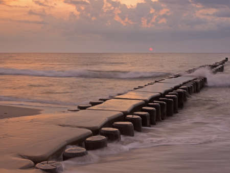 Groyne in the Baltic Sea near to Ahrenshoop, Mecklenburg-Western Pomerania, at sunsetの写真素材