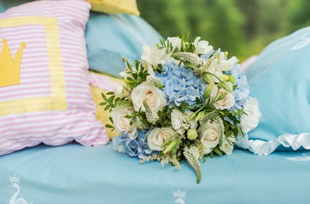Wedding bouquet for bride on the bed. Beautiful decoration on the nature.の写真素材