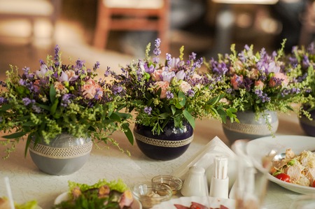 Floral arrangements from lavender and herbs. Wedding party decoration.