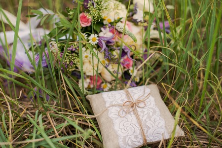 Beautiful wedding bouquet for the bride on the grass.の写真素材