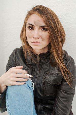 Girl with a dirty face of the engine oilの写真素材