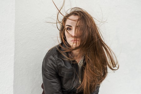 Girl with a dirty face of the engine oilの写真素材