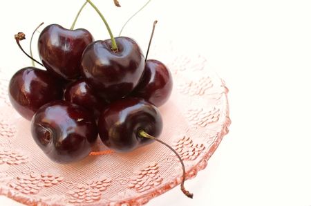 Red cherry are in lady hands.の写真素材