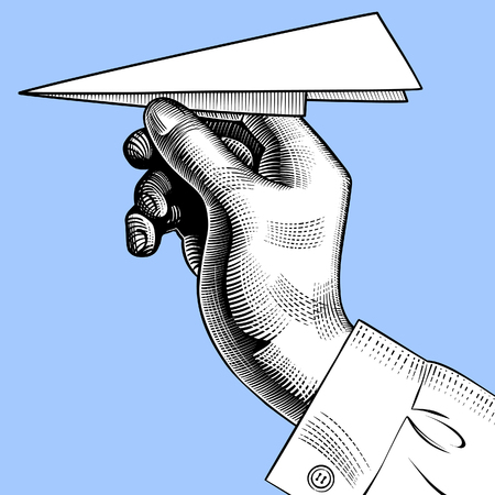 Hand with a paper plane. Vintage engraving stylized drawing. Vector Illustrationのイラスト素材