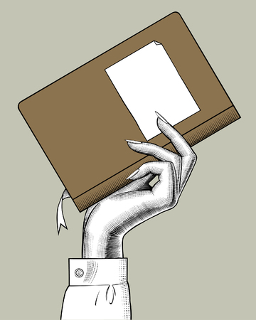 Hand of woman holding a book. Vintage engraving stylized drawing. Vector illustrationのイラスト素材