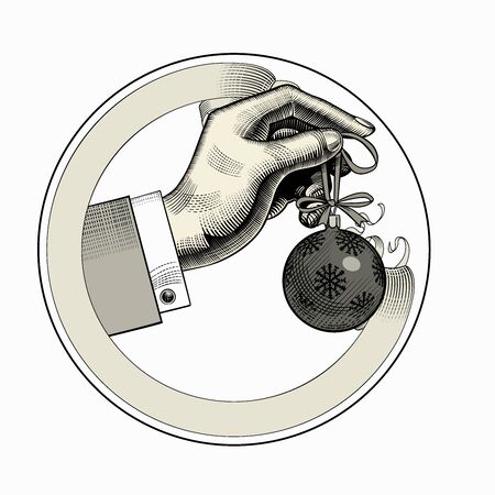 Hand hanging a Christmas tree ball on a spruce branch with a ribbon. Vintage engraving stylized drawing. Vector illustrationのイラスト素材