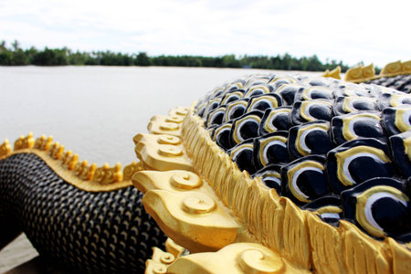 Close Up Black and Gold colors of Beautiful Molding of Praya Nark showing in Thai Temple Praya Nark or Naga is fabulous serpent or serpent dragon the big snake in Thai story from Thailandの写真素材