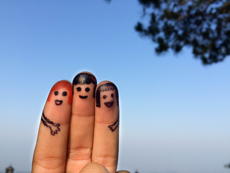 three smiling fingers that are very happy to be best friendsの写真素材