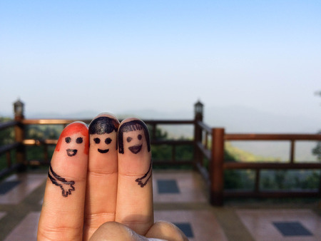 three smiling fingers that are very happyの写真素材