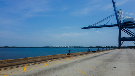 American port military dock shot with blue sky cargo shipsの写真素材