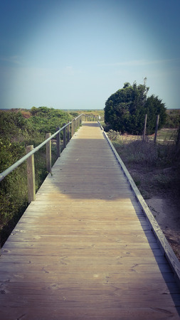 old wooden bridge to cross the wayの写真素材