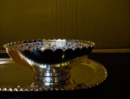 silver bowl on a plateの写真素材