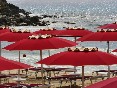 Red umbrealla and seaの写真素材
