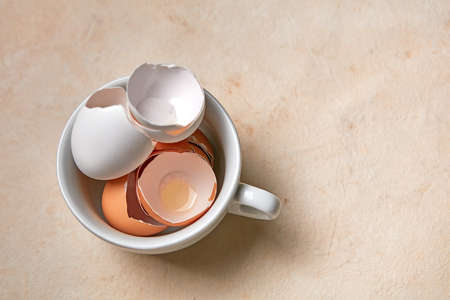 chicken shell in a white cup on a light background.