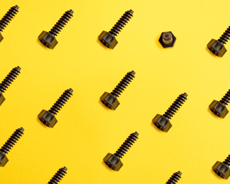 Baby plastic bolts on the yellow background. pattern