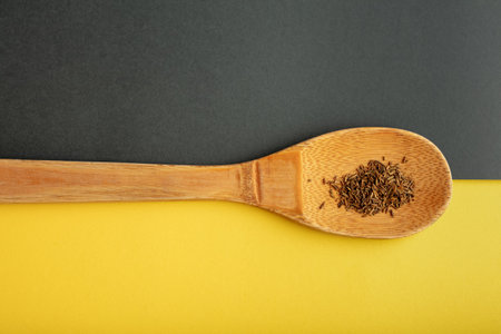 Top view of spices on grey and yellow background. Flat lay.の写真素材