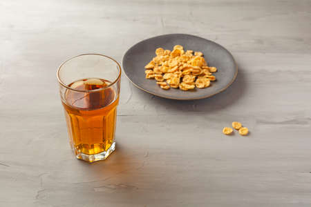 Muesli and a glass of tea on the table. Healthy and fiber. Breakfast time