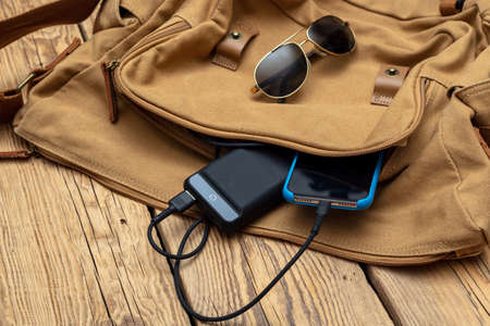 Charging the empty battery smartphone with power bank.