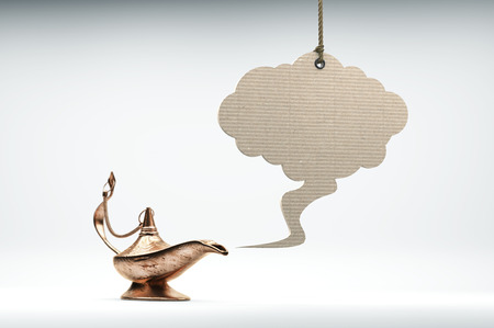 Write a wish on the paper cloud from ancient magic lampの写真素材