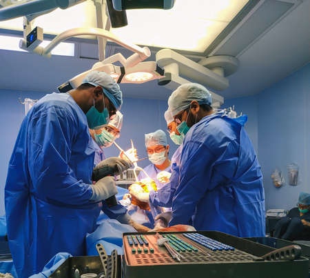 Delhi, India- June 5, 2020: Process of trauma surgery operation. Group of surgeon in operating room with surgery equipment. Medical backgroundのeditorial素材