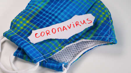 Medical face mask on table background. Novel coronavirus 2019-nCoV concept.