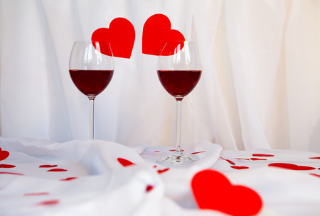 glass of red wine with heartsの写真素材