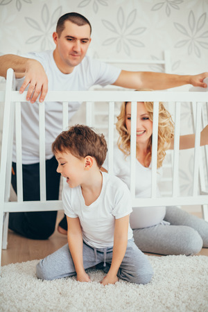 happy family.a pregnant woman.interior. peopleの写真素材