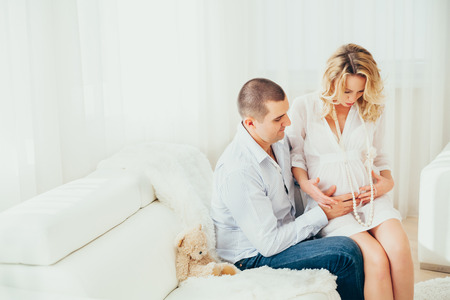 happy family.a pregnant woman.interior.couple
