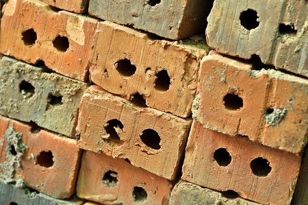 A brick is a block of ceramic material used in masonry construction, usually laid using various kinds of mortar.の写真素材