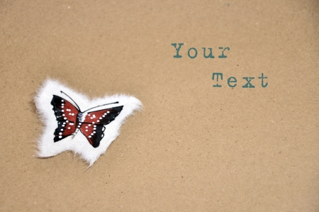 Paint a little butterfly on brown paper の写真素材