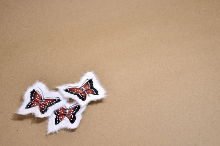 Paint a little butterfly on brown paper の写真素材