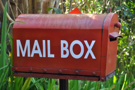 mailbox with red semaphore flag  When raised, the flag indicates outgoing mail の写真素材
