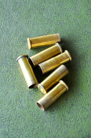 a casing containing a charge and a bullet or shot for small arms or an explosive charge for blasting.の写真素材
