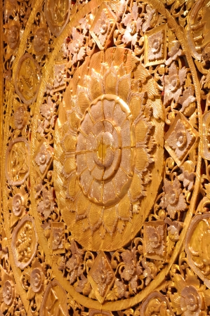 Wall wood carved golden lotus bloom  Used to decorate the hall の写真素材